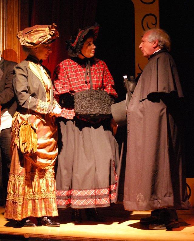 Transformed Scrooge pledging to the Charity Collectors