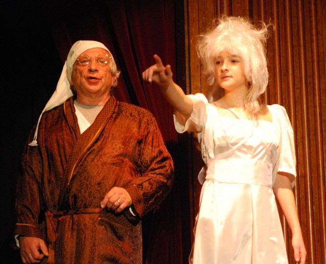 The Ghost of Christmas Past showing Scrooge the Truth.